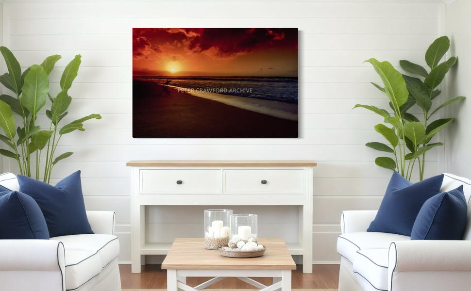 Sunset Favourite displayed above a fireplace in a bright living room. Peter Crawford Archive.