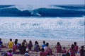 Surfer at the 1988 Pipe Masters at Pipeline in Hawaii, photographed by Peter Crawford.