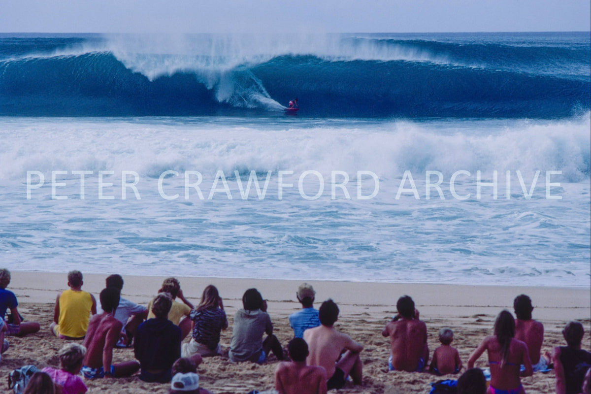 Surfer at the 1988 Pipe Masters at Pipeline in Hawaii, photographed by Peter Crawford.