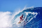 Marvin Foster surfing Pipeline in Hawaii in 1987, photographed by Peter Crawford.