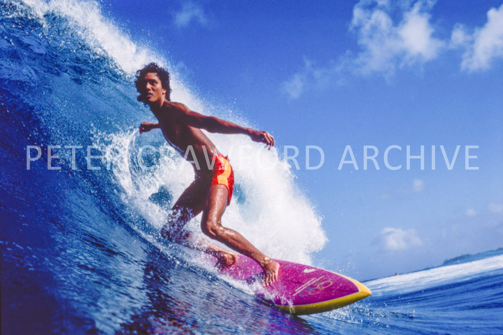 Larry Bertlemann surfing Off The Wall in Hawaii, photographed by Peter Crawford.