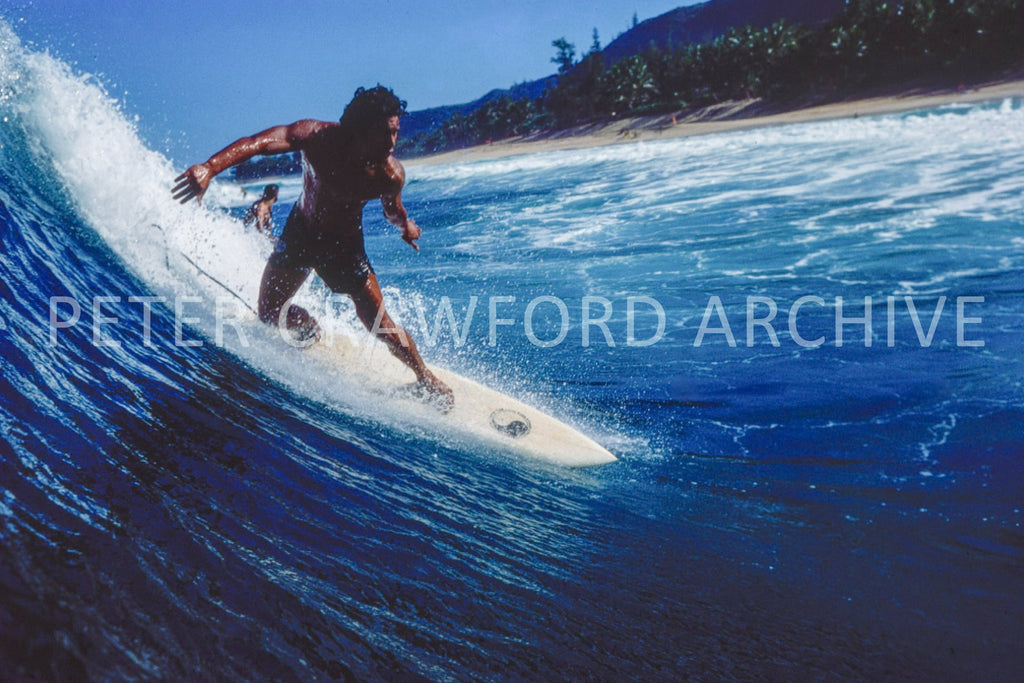 Dane Kealoha surfing Off The Wall in Hawaii in 1978, photographed by Peter Crawford.