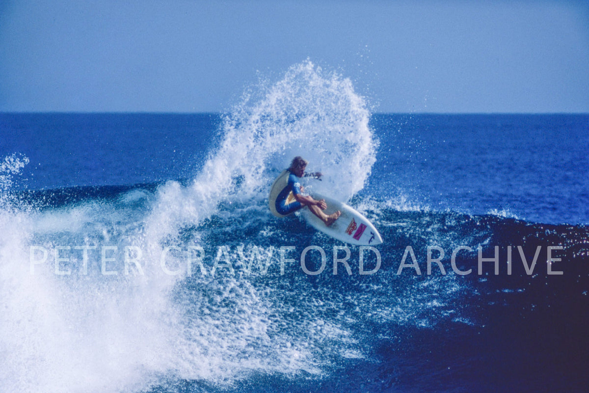 Occy surfing a top turn in 1984, photographed by Peter Crawford.