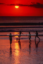 Children at sunset in Indonesia, photographed by Peter Crawford.