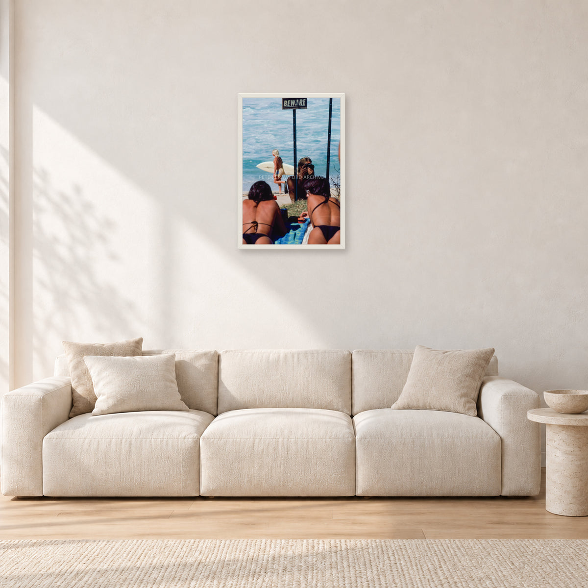 Beware Girls, 1985 by Peter Crawford — 40 × 60 cm, white frame, shown in a light minimalist living room.