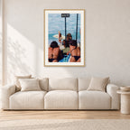 Beware Girls, 1985 by Peter Crawford — 60 × 90 cm, hayseed frame with white mat, shown in a light minimalist living room.