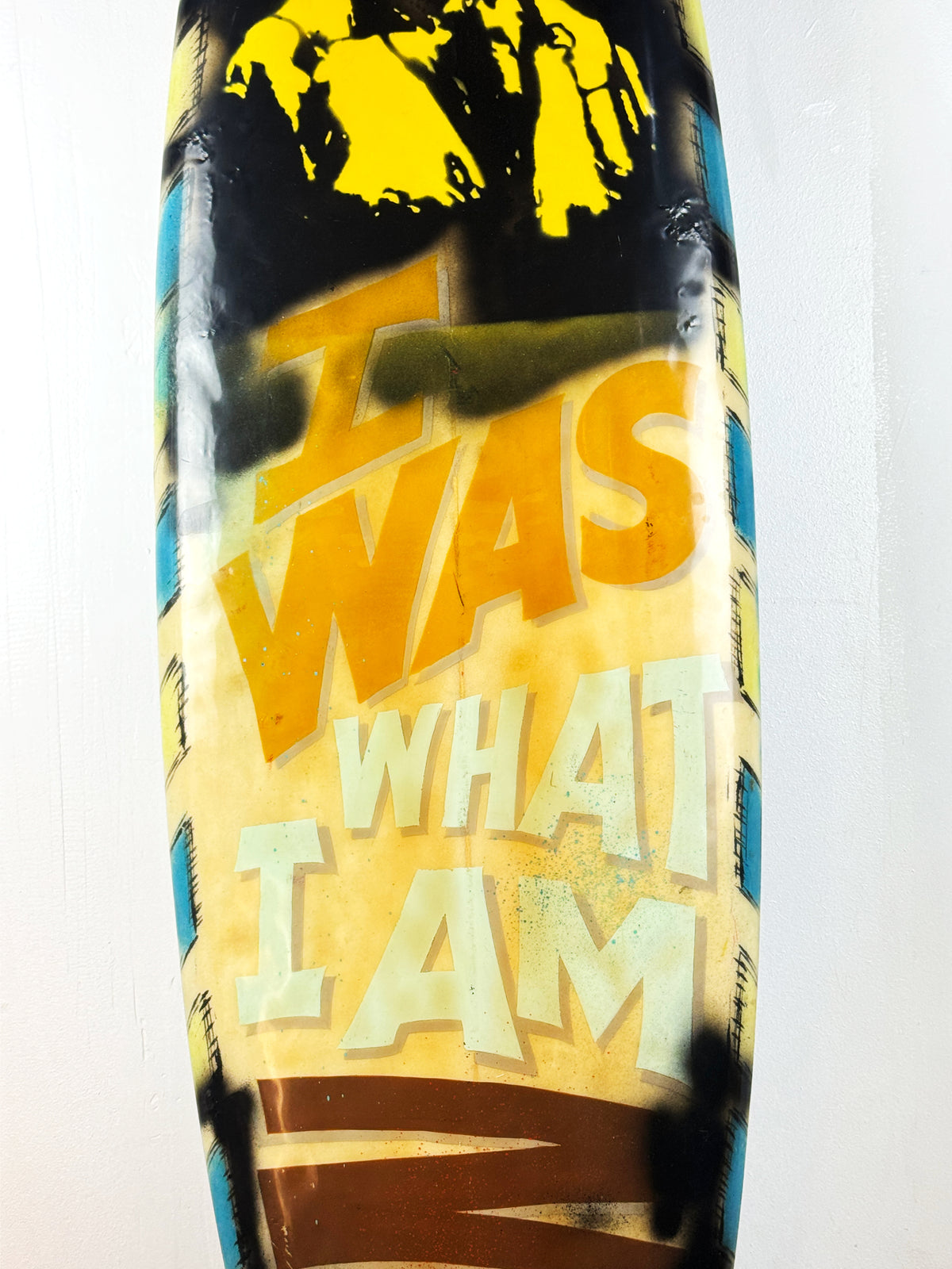 What I am Now Surfboard by David Bromley — central hand-painted lettering detail.