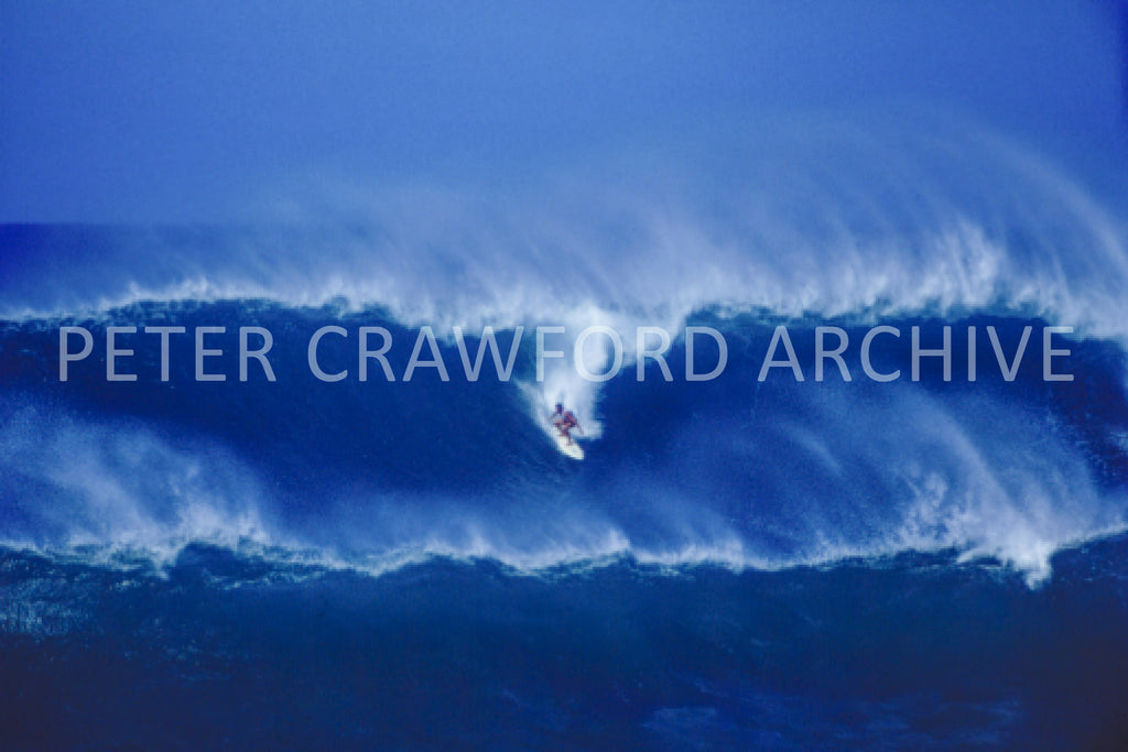 Unknown surfer at Sunset Beach in Hawaii, photographed by Peter Crawford.