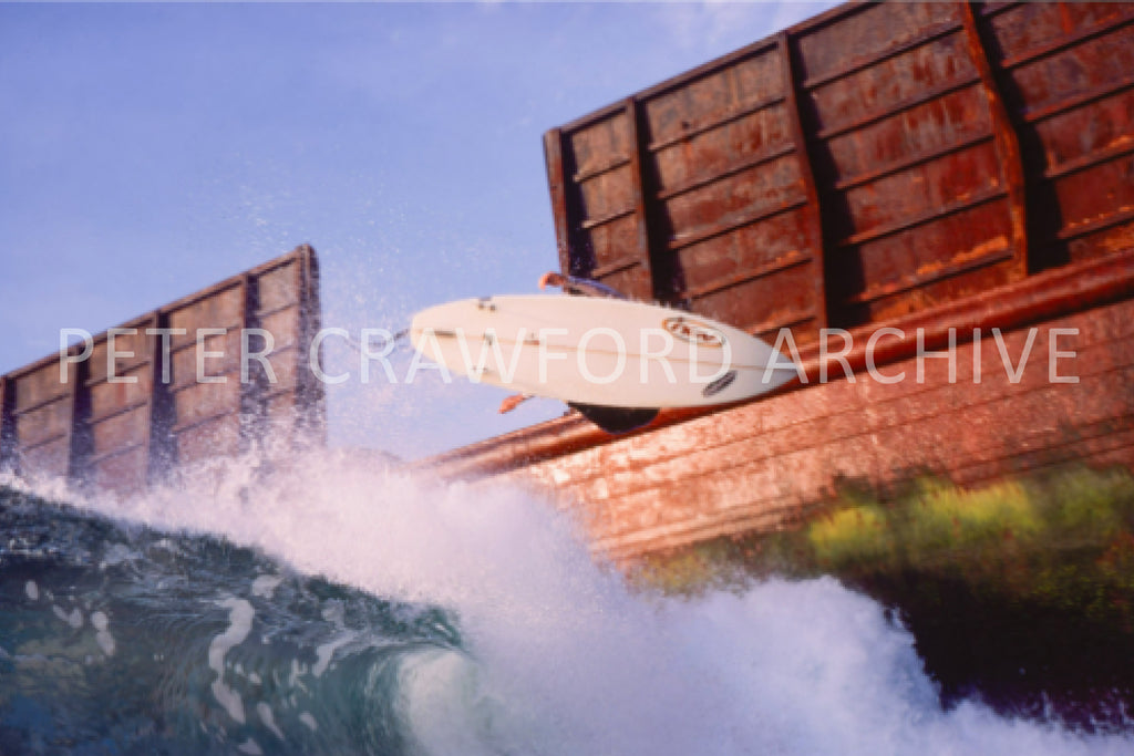 Dave Smith surfing in Bali, Indonesia in 1999, photographed by Peter Crawford.