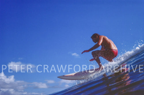 Bruce Raymond surfing in 1976, photographed by Peter Crawford.