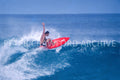 Surfer at Sunset Beach in Hawaii, photographed by Peter Crawford.