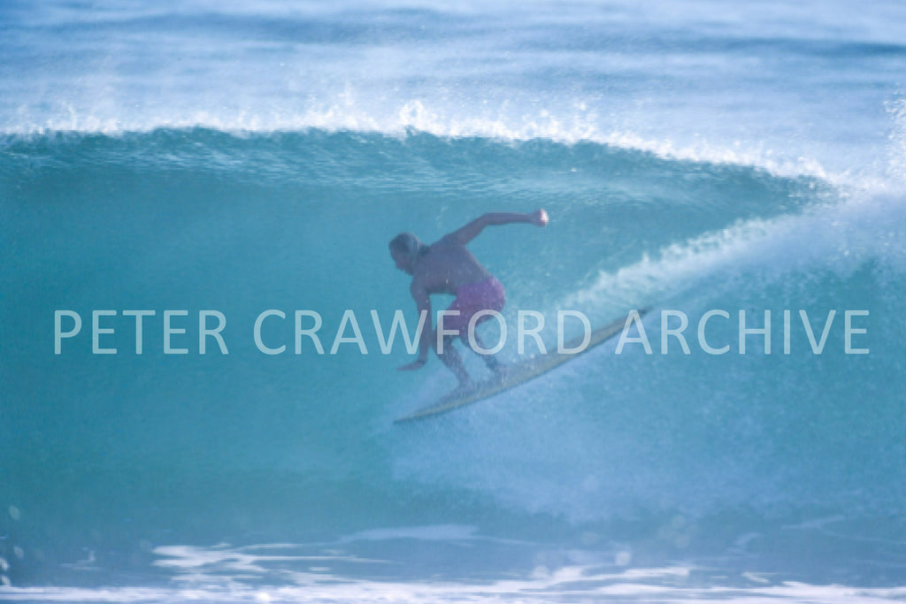 Russell L surfing, photographed by Peter Crawford.