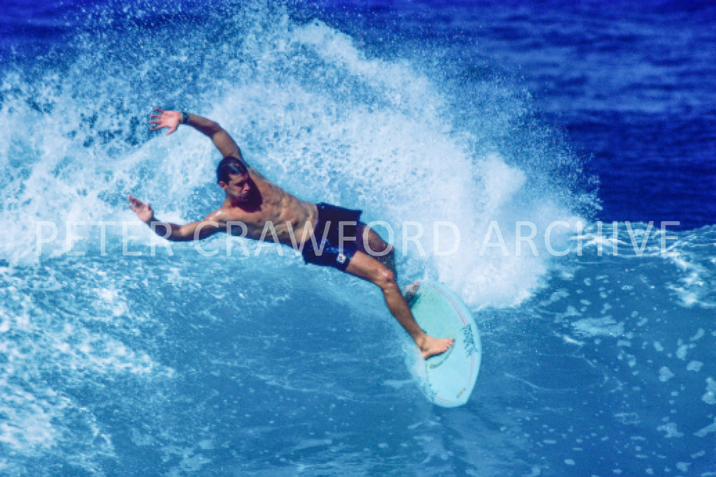 Paul Burnett surfing in Hawaii in 1989, photographed by Peter Crawford.