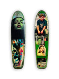 Skateboard 2 by David Bromley — portrait and seated-boy imagery on a green-toned skateboard deck, painted deck displayed above a glass-topped wooden crate.