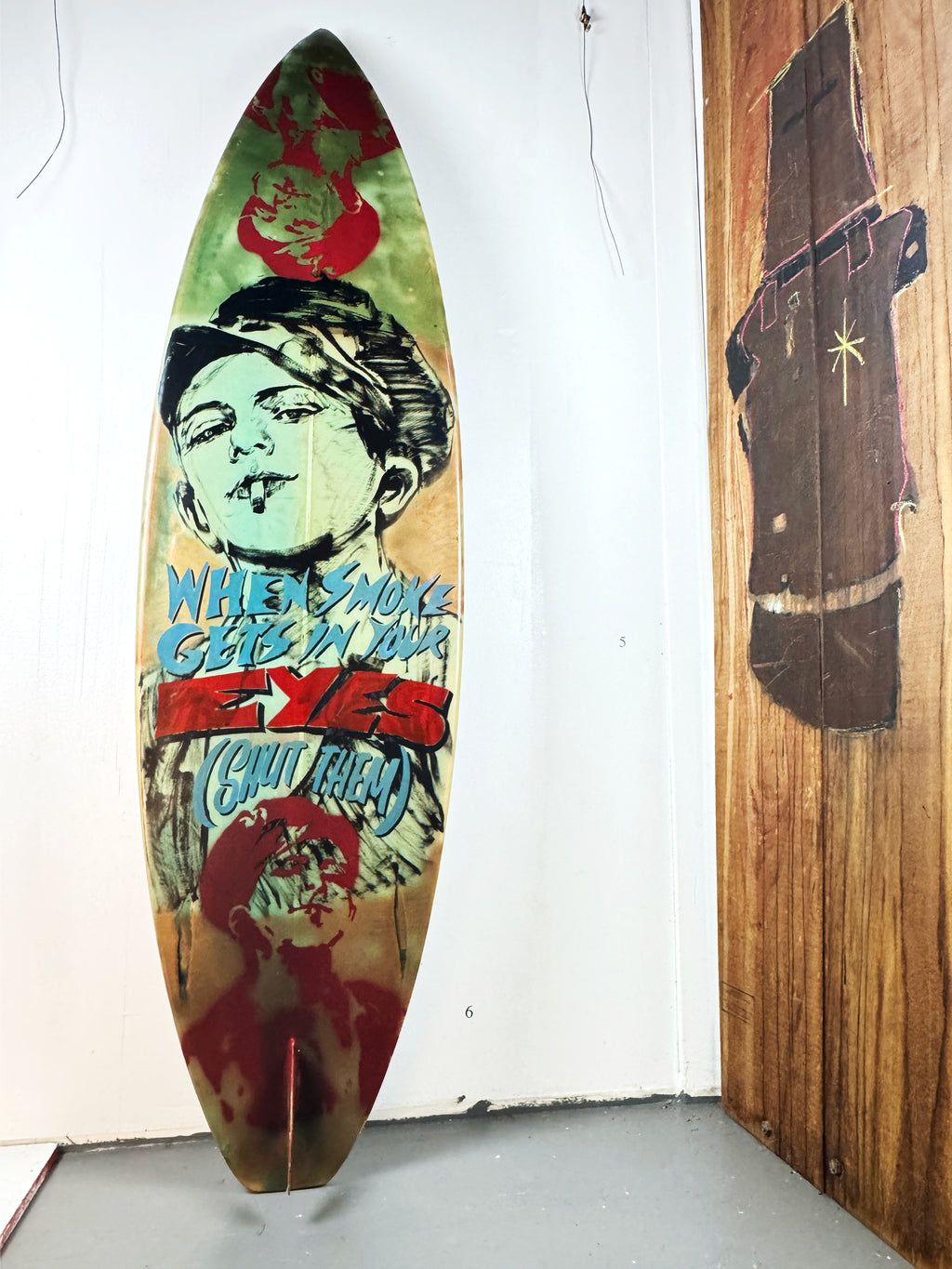 Queens Surfboard by David Bromley — cream portrait side standing in the gallery.