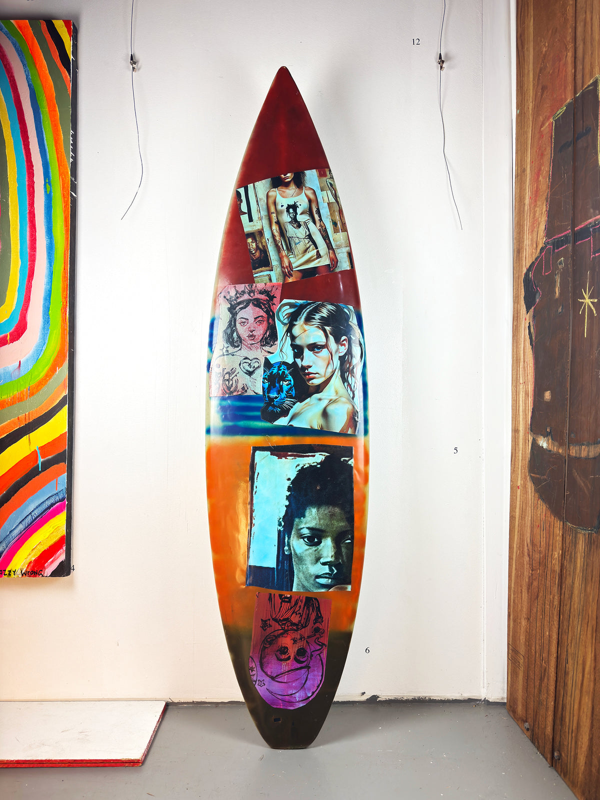 Queens Surfboard by David Bromley — red portrait side standing in the gallery.
