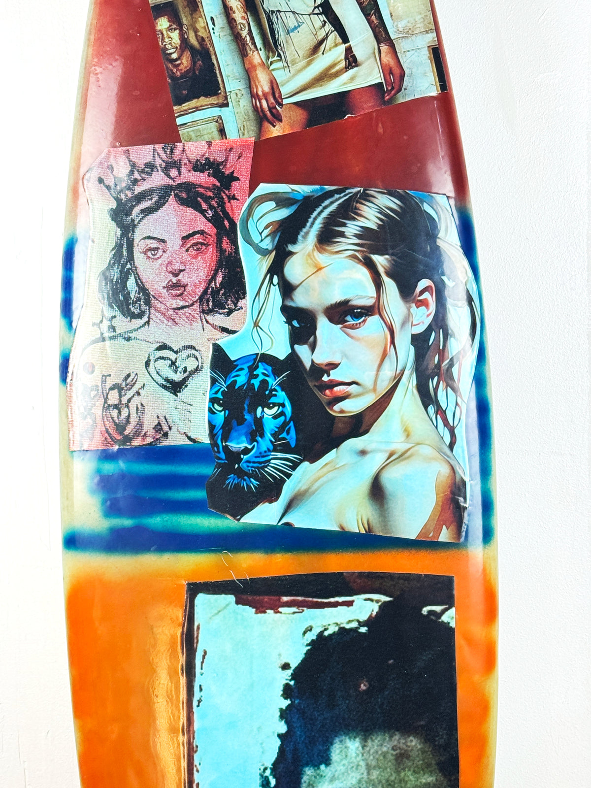 Queens Surfboard by David Bromley — central red-side portrait collage detail.