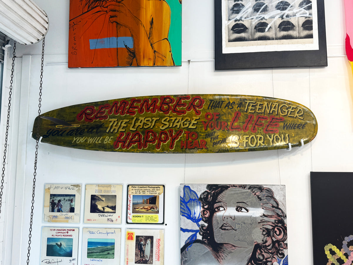 Teenager Malibu by David Bromley: hand-painted lettering across a long surfboard.