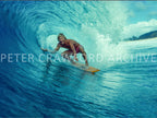 Surfer tube riding on the North Shore of Hawaii in the 1970s, photographed by Peter Crawford.
