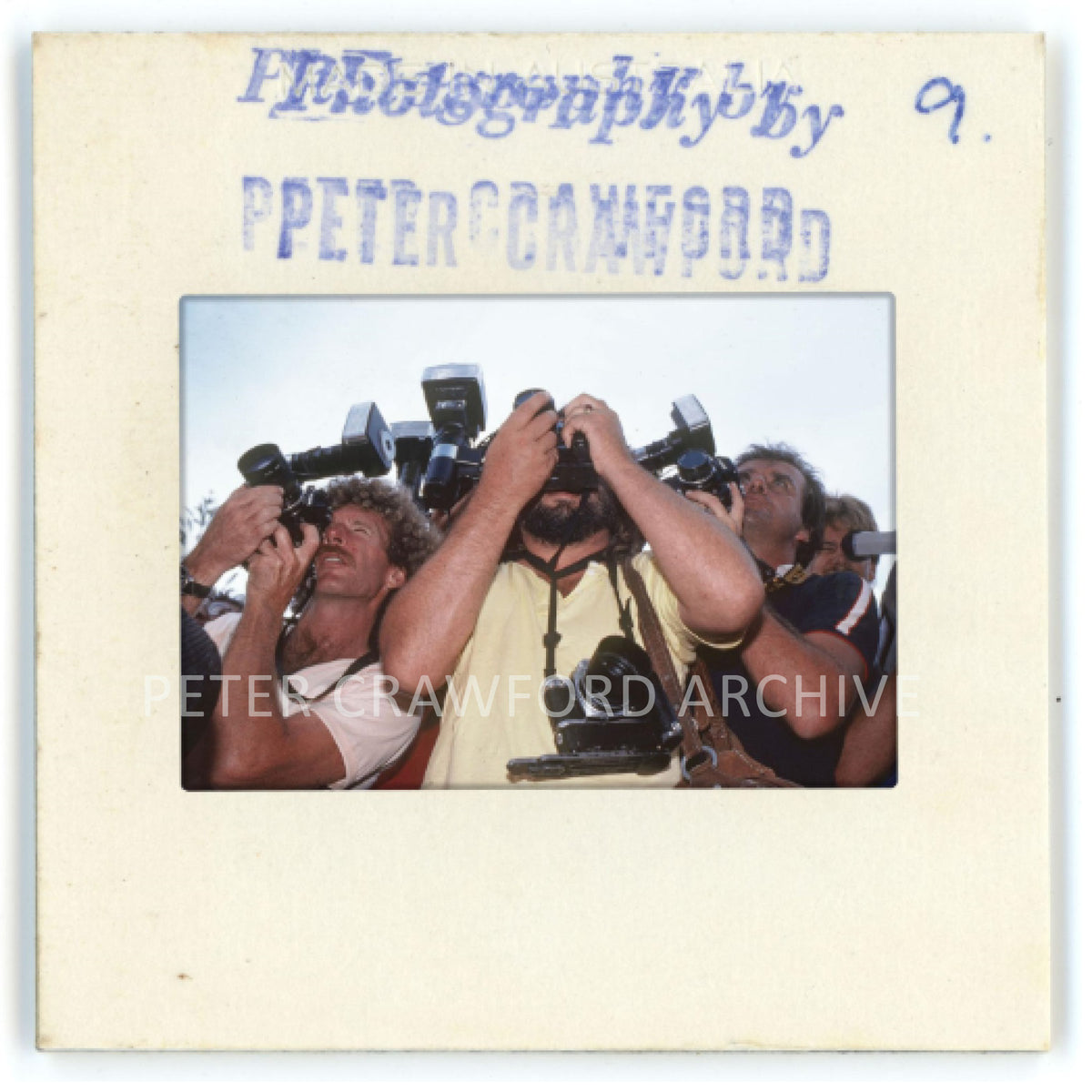 Surf photographers, including Art Brewer, gather at Huntington Beach during the US Open of Surfing. Peter Crawford Archive.
