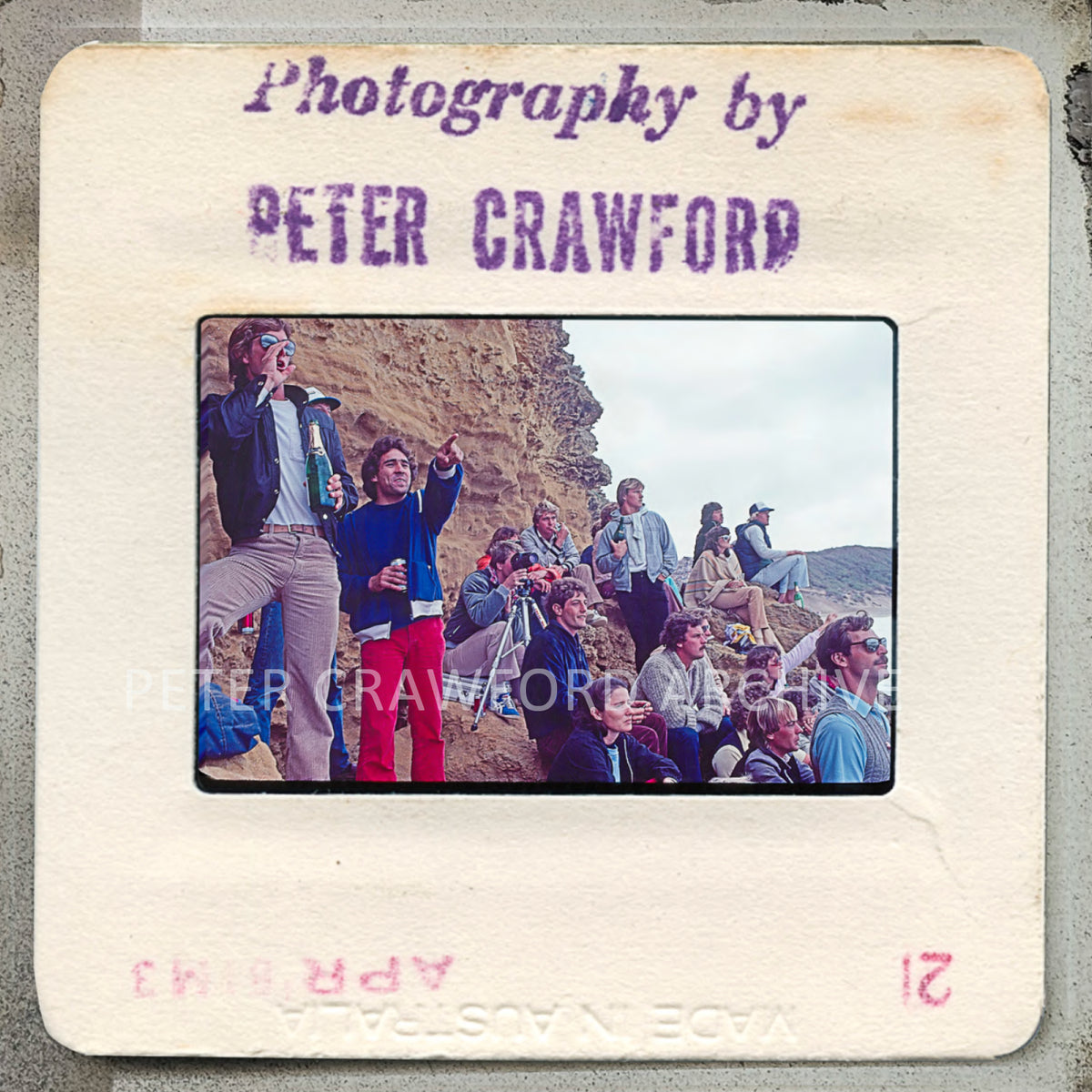 Maurice Cole and fellow surfers watch the 1981 Rip Curl Pro final from the Rincon rocks. Peter Crawford Archive.