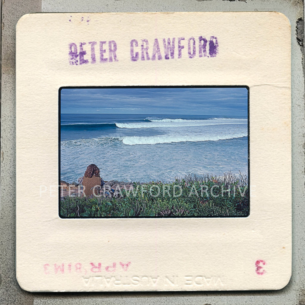 A lone spectator watches Derek Hynd at outer Rincon during the 1981 Rip Curl Pro. Peter Crawford Archive.