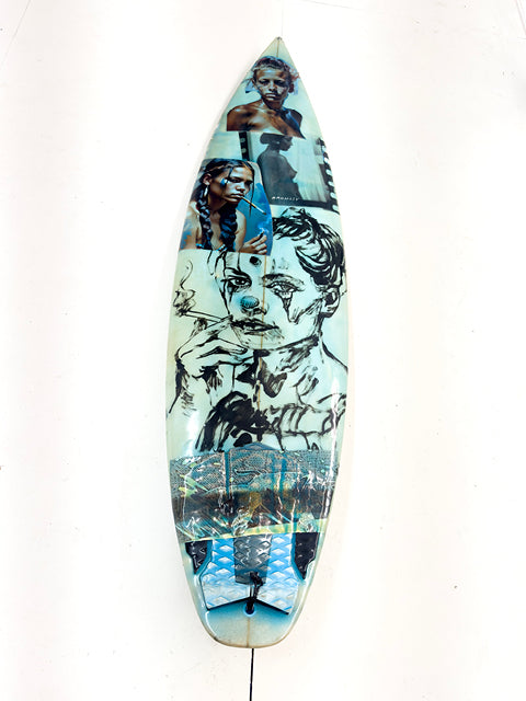 Blue Surfboard by David Bromley: blue-toned portraits, figures and collage imagery across a surfboard.