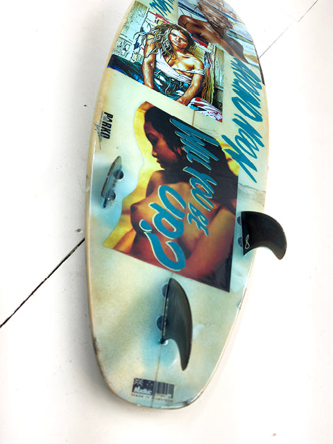 Blue Surfboard by David Bromley — reverse side with portrait collage and visible fins.