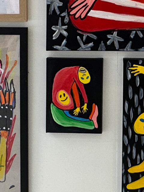 Double Happiness by Brodie Jackson: two intertwined figures in red and green on black — gallery view.
