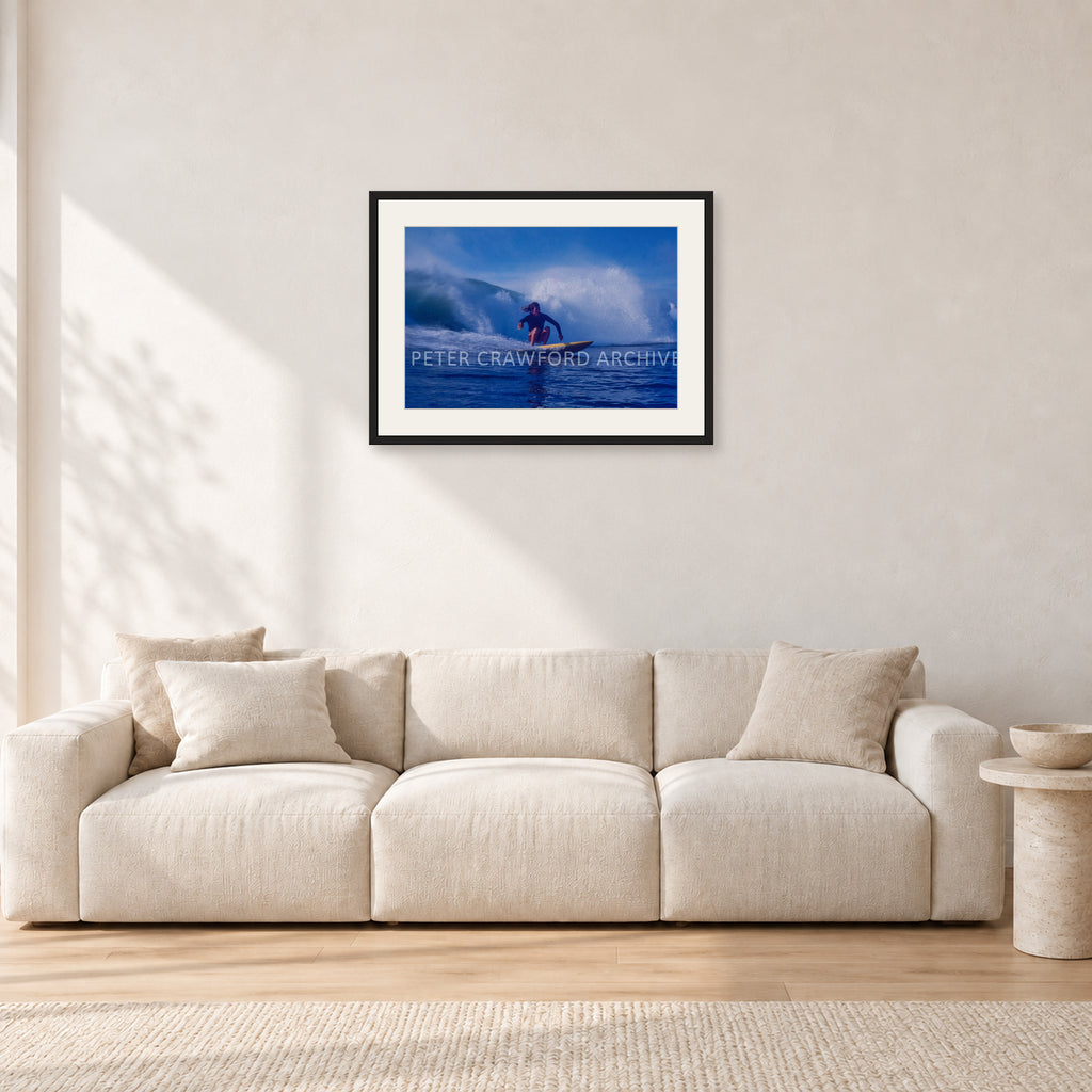 Angourie Point, Yamba 1976 by Peter Crawford — 60 × 40 cm, black frame with white mat, shown in a light minimalist living room.