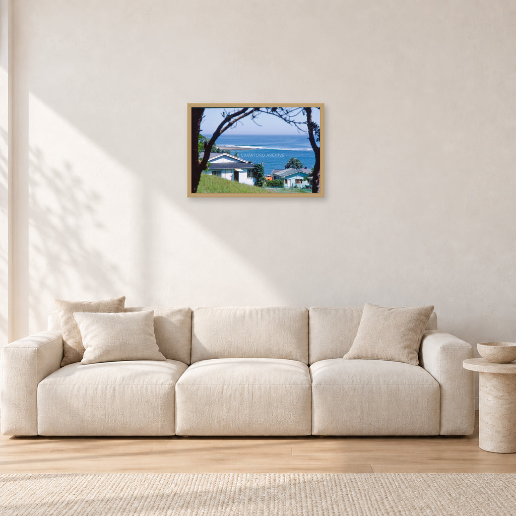 Aussie Pipe by Peter Crawford — 60 × 40 cm, hayseed frame, shown in a light minimalist living room.