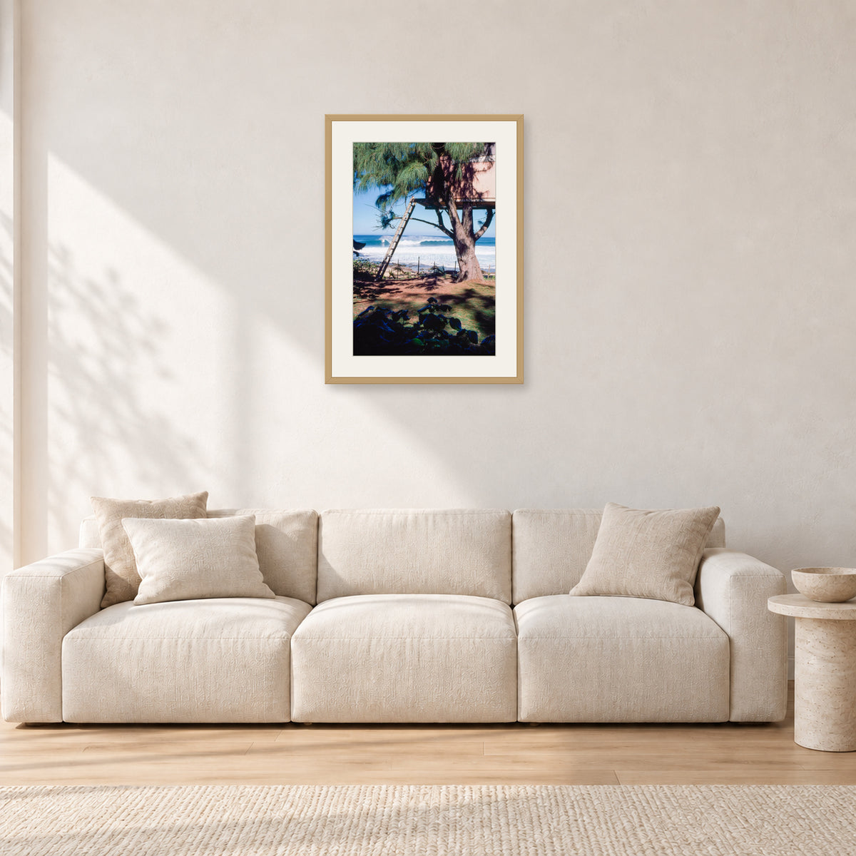 Backdoor Pipeline Tree House by Peter Crawford — 40 × 60 cm, hayseed frame with white mat, shown in a light minimalist living room.