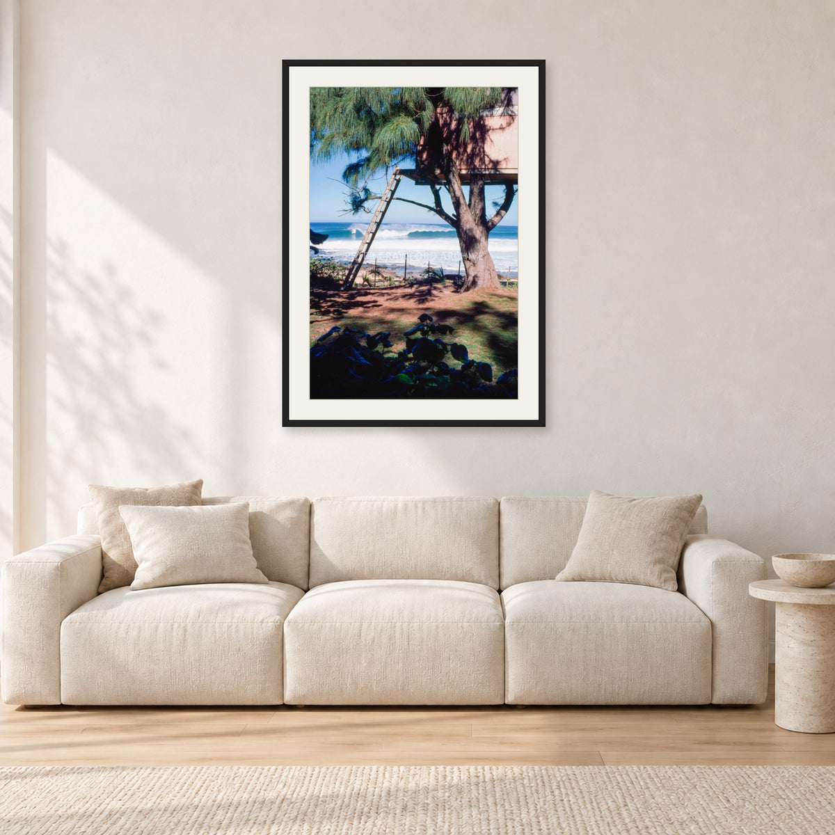 Backdoor Pipeline Tree House by Peter Crawford — 60 × 90 cm, black frame with white mat, shown in a light minimalist living room.