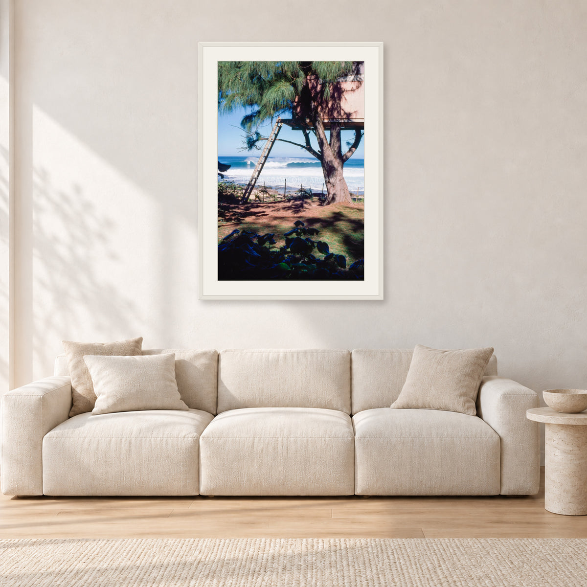 Backdoor Pipeline Tree House by Peter Crawford — 60 × 90 cm, white frame with white mat, shown in a light minimalist living room.