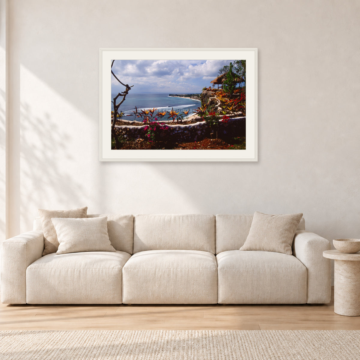 Bali, Peter Crawford by Peter Crawford — 90 × 60 cm, white frame with white mat, shown in a light minimalist living room.