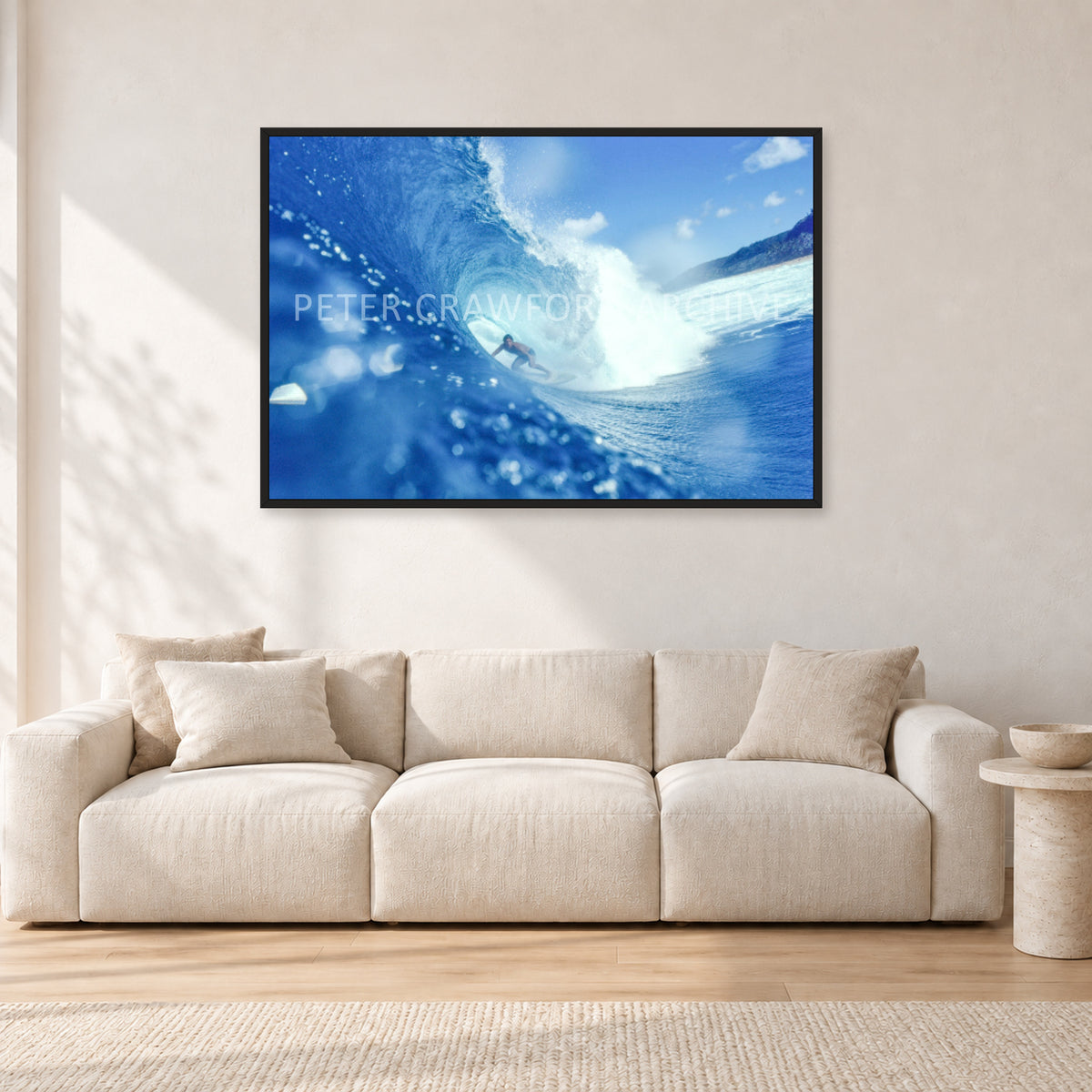 Banzai Pipeline, Hawaii 1976 by Peter Crawford — 120 × 80 cm, black frame, shown in a light minimalist living room.