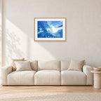 Banzai Pipeline, Hawaii 1976 by Peter Crawford — 60 × 40 cm, hayseed frame with white mat, shown in a light minimalist living room.