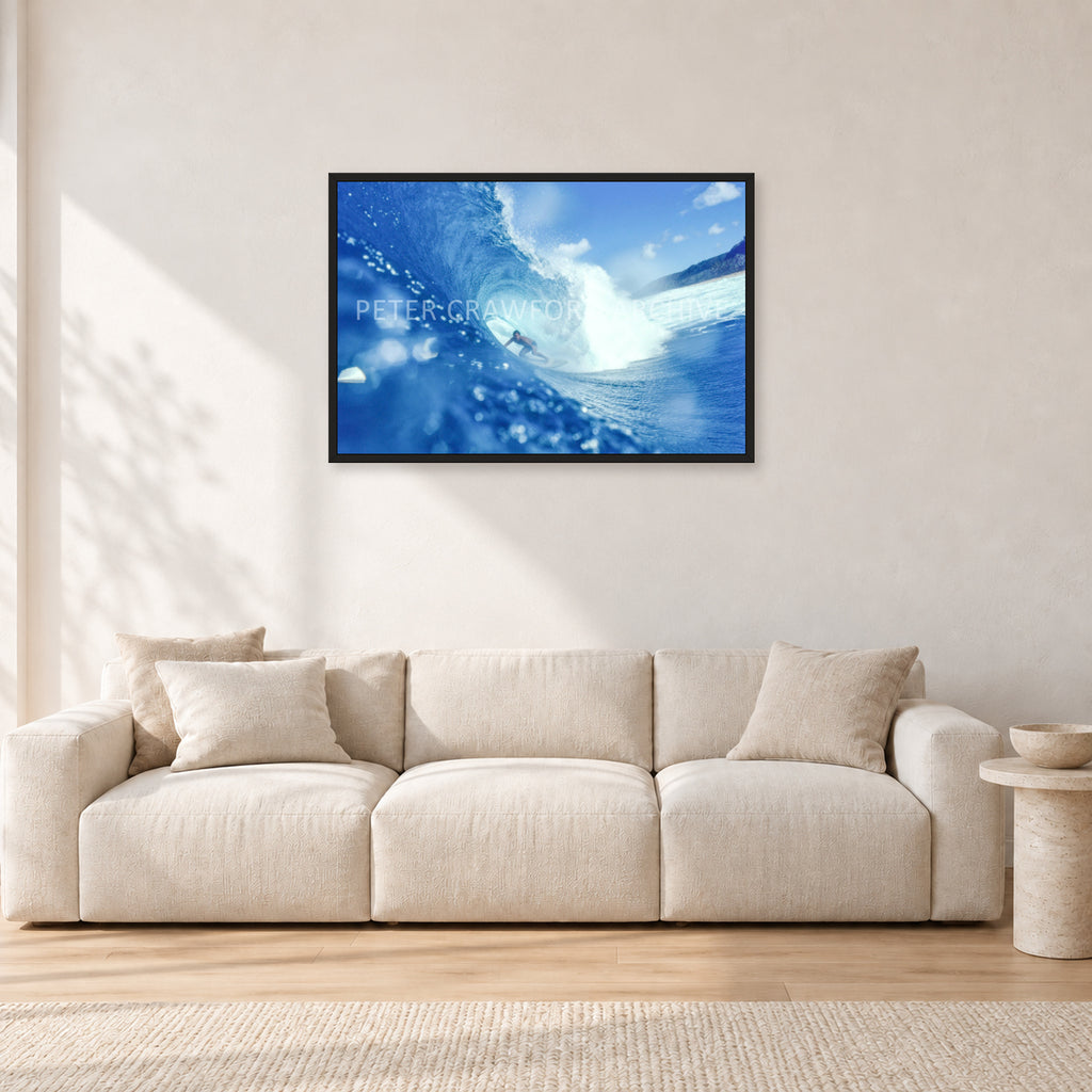 Banzai Pipeline, Hawaii 1976 by Peter Crawford — 90 × 60 cm, black frame, shown in a light minimalist living room.