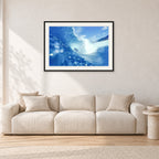 Banzai Pipeline, Hawaii 1976 by Peter Crawford — 90 × 60 cm, black frame with white mat, shown in a light minimalist living room.