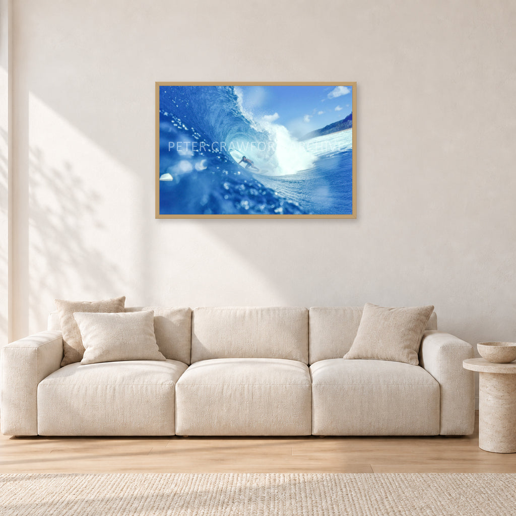 Banzai Pipeline, Hawaii 1976 by Peter Crawford — 90 × 60 cm, hayseed frame, shown in a light minimalist living room.