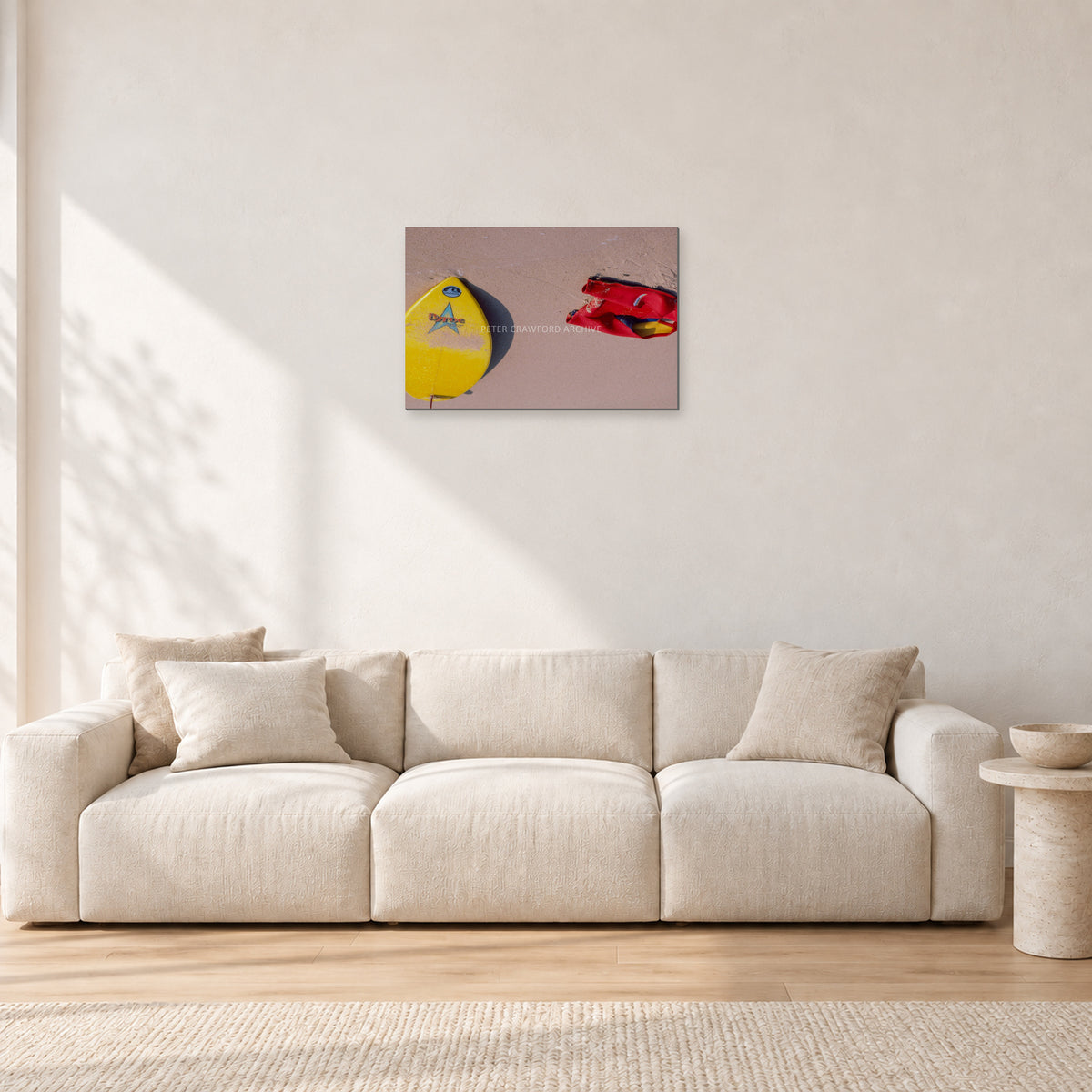 Bells Beach Overview, 1983 by Peter Crawford — 60 × 40 cm, aluminium-mounted resin print, shown in a light minimalist living room.