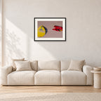 Bells Beach Overview, 1983 by Peter Crawford — 60 × 40 cm, black frame with white mat, shown in a light minimalist living room.