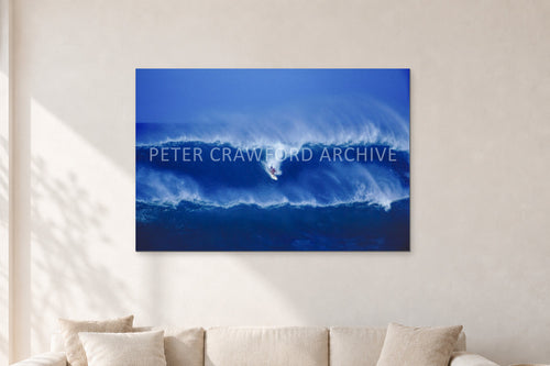 Big Sunset, Unknown Surfer by Peter Crawford — 120 × 80 cm, aluminium-mounted resin print, shown in a light minimalist living room.
