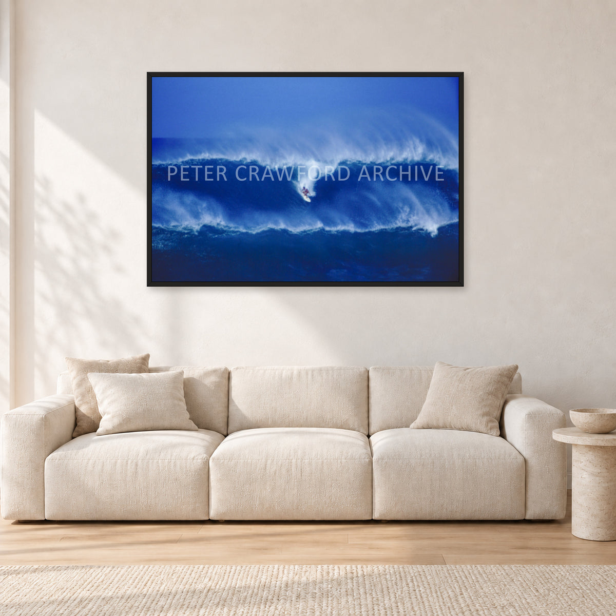 Big Sunset, Unknown Surfer by Peter Crawford — 120 × 80 cm, black frame, shown in a light minimalist living room.