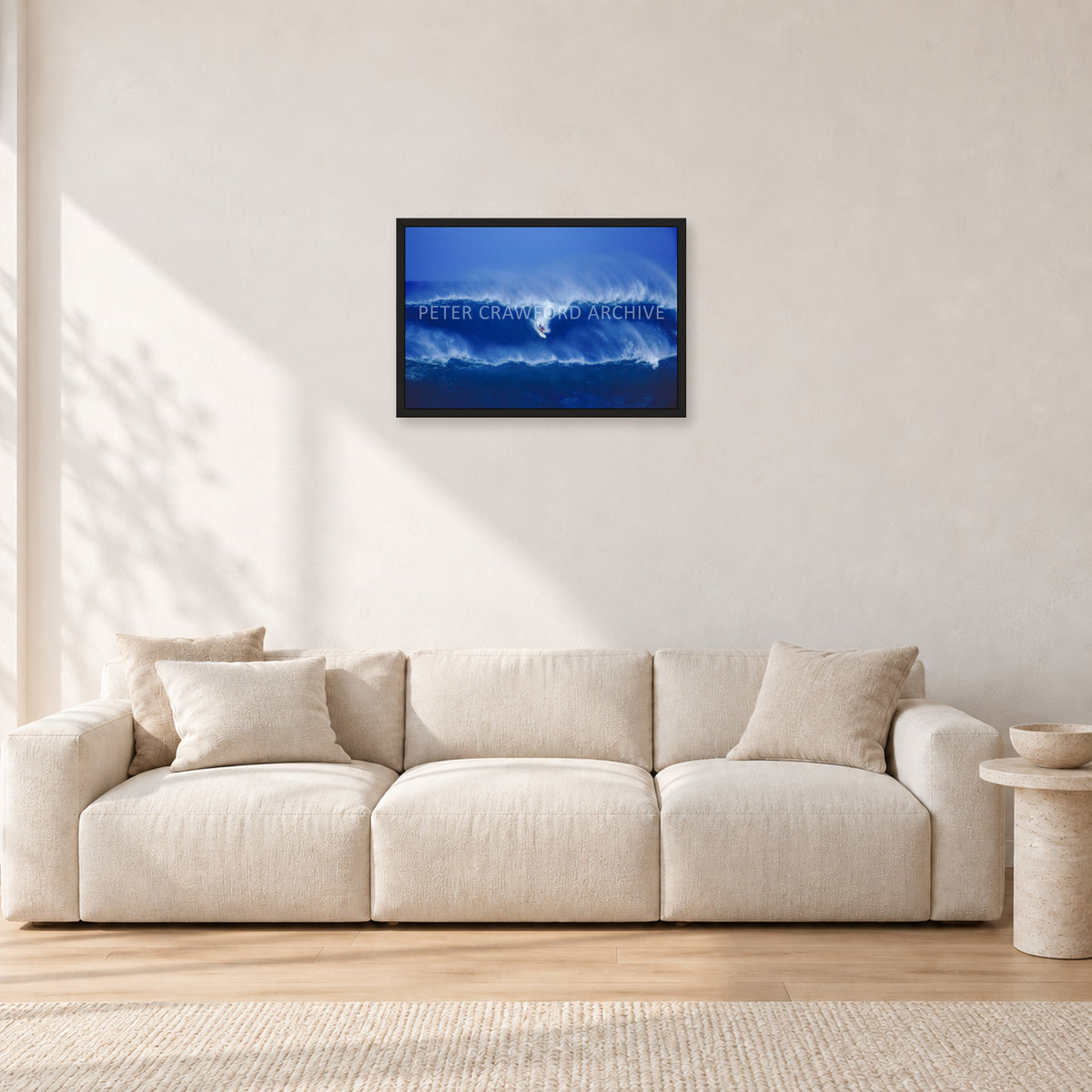 Big Sunset, Unknown Surfer by Peter Crawford — 60 × 40 cm, black frame, shown in a light minimalist living room.