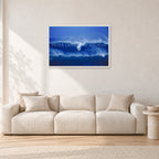 Big Sunset, Unknown Surfer by Peter Crawford — 90 × 60 cm, white frame, shown in a light minimalist living room.