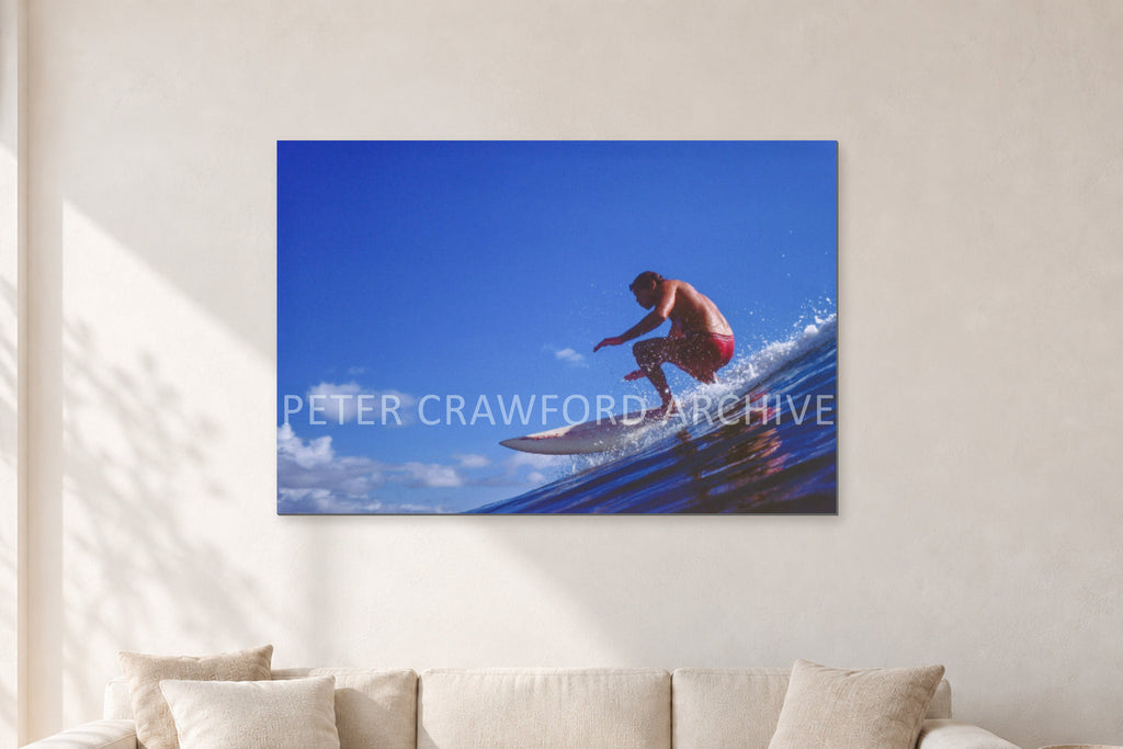 Bruce Raymond, 1976 by Peter Crawford — 120 × 80 cm, aluminium-mounted resin print, shown in a light minimalist living room.