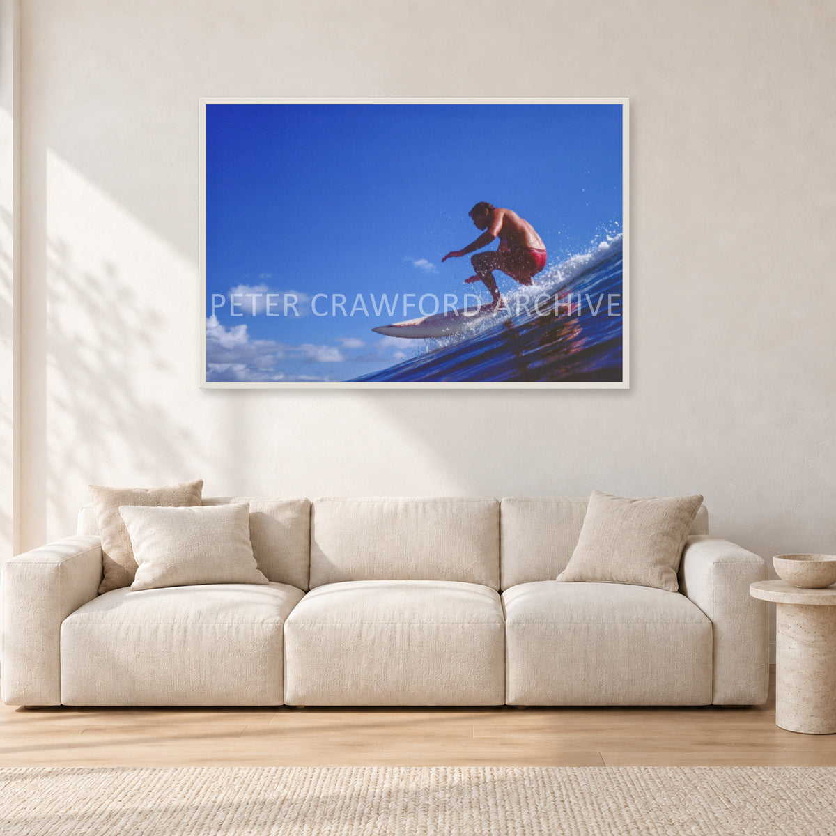 Bruce Raymond, 1976 by Peter Crawford — 120 × 80 cm, white frame, shown in a light minimalist living room.