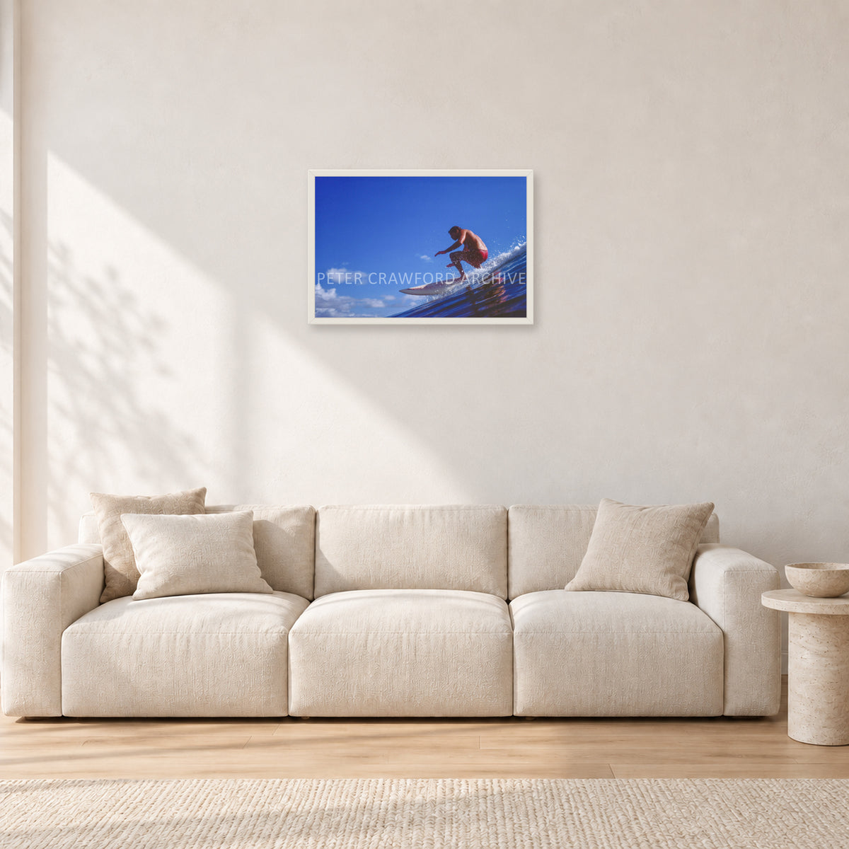 Bruce Raymond, 1976 by Peter Crawford — 60 × 40 cm, white frame, shown in a light minimalist living room.