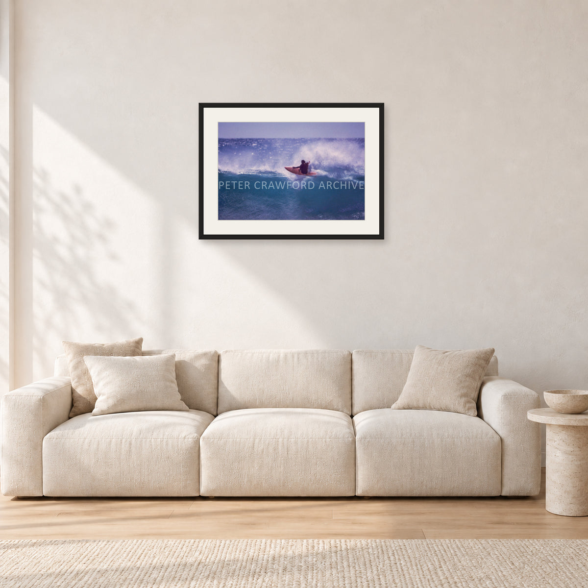 Bruce Raymond, Stubbies 1980 by Peter Crawford — 60 × 40 cm, black frame with white mat, shown in a light minimalist living room.